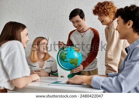 Teens discuss global issues using globe at Model UN.