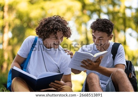 Teens learning lessons and looking involved while reading books