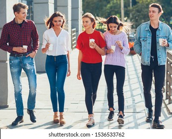 Teens Leisure. Social Communication Fun. Group Of Male Female Friends Walking With Take Away Coffee.