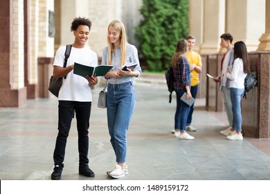 Teens preparing for classes, studying with books in university campus outdoors - Shutterstock ID 1489159172