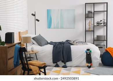 Teen's room interior with modern furniture and beautiful picture on wall - Powered by Shutterstock