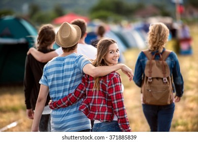 Teens at summer festival. Young teens at summer music festival. Funny group of young girls and boys at music festival. Happy teen at summer festival.