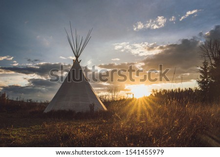 Teepee Tipi at sunset with dramatic sky