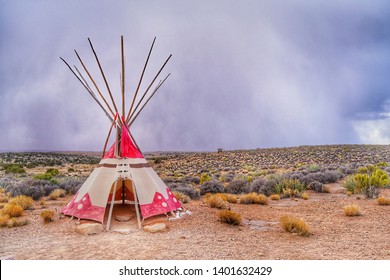 Teepee, Tipi or wigwom, a traditional cone-shape tent used by Indian in North america. Taken from reservation area in Grand Canyon West Rim, Arizona, USA. Heavily raining in the background.