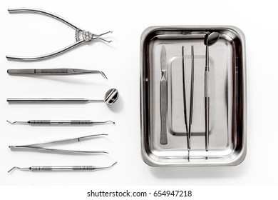 Teeth Care With Dentist Instruments In Doctor's Office White Background Top View