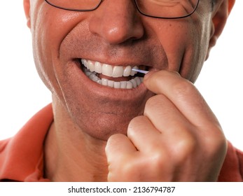 Teeth Cleaning - A Dental Stick, A Man Cleans White Teeth