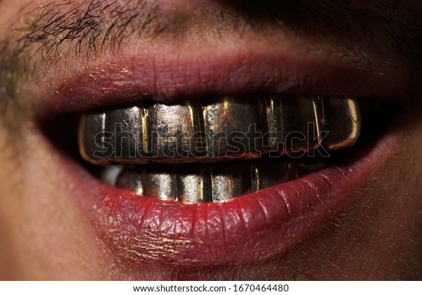 Teeth. Mans gold smile. Perfect gold teeth. Golden\
teeth grillz