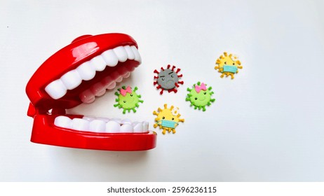 Teeth model showing human teeth structure. Toy teeth for educational purposes, isolated on white background. Teeth look dirty and full of bacteria. Free space for text.