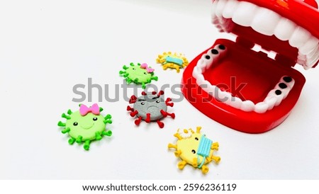 Teeth model showing human teeth structure. Toy teeth for educational purposes, isolated on white background. Teeth look dirty and full of bacteria. Free space for text.