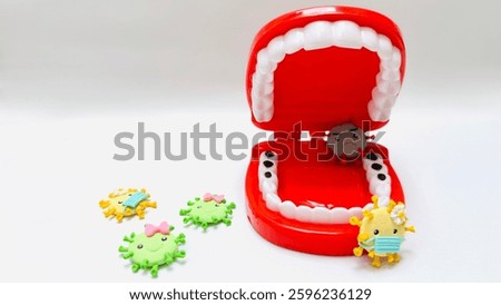 Teeth model showing human teeth structure. Toy teeth for educational purposes, isolated on white background. Teeth look dirty and full of bacteria. Free space for text.