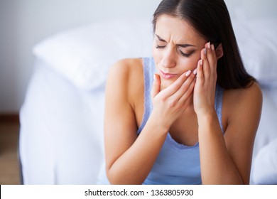 Teeth Pain. Beautiful Woman Suffering From Painful Toothache