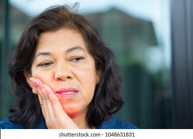 Teeth Problem.Asian Senior Woman Feeling Tooth Pain.Sad Senior Woman Suffering From Strong Tooth Pain.