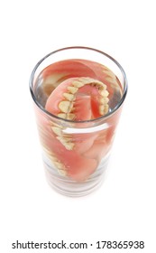 https://image.shutterstock.com/image-photo/teeth-prosthesis-glass-isolated-on-260nw-178365938.jpg