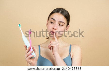 Teeth with tooth brush. Clean teeth. Perfect womans smile. Healthy white theeth. Beauty woman with perfect lips and smile. Dental care and teeth whitening. Close-up of perfect smile with tooth brush