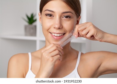 Teeth Whitening, Beautiful Smiling Woman Holding A Whitening Strip.