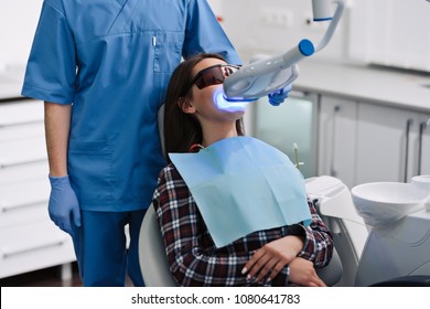 Teeth whitening for woman. Bleaching of the teeth at dentist clinic. - Powered by Shutterstock