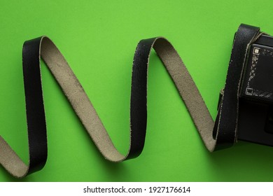 Tefillin with rolled cowhide straps, green background