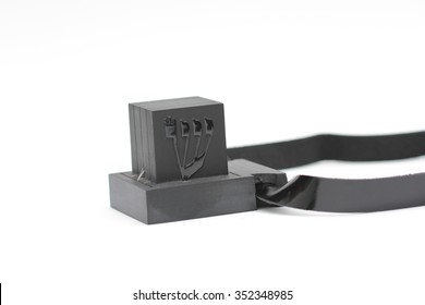  tefillin, A symbol of the Jewish people, a pair of tefillin with black straps, isolated on a white background