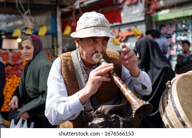 Tehran / Iran - March 19 2017: Nowruz ( Persian New Year ) Ceremony In Streets Of Tehran And A Traditional Flute Player Wearing Historic Clothes.