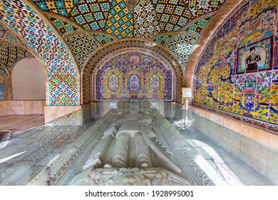TEHRAN, IRAN - MARCH 28, 2018: Carved marble sarcophagus of Persian Shah in a glass case in Khalvate Karim Khani section of the Golestan Palace in Tehran, Iran