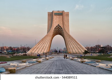 TEHRAN, IRAN - NOVEMBER 25, 2016: View of the Azadi Tower in the light of the setting sun. The tower is one of the symbols of the city and Azadi Square most visited place by tourist.