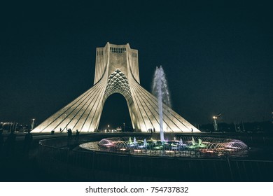 Tehran, Iran-CIRCA October 2017. A Dramatic Color Nightscape View Of The Azadi Tower, Located At Azadi Square. It Is A Symbol For 2,500th Year Of The Foundation Of The Imperial State Of Iran.