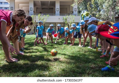 Tekirova, Kemer, Turkey - May 2017: Animators Play Ball With Children At A Kids Club In A Turkish Hotel In A Beach Resort. Children Stand Around. Hotel TUI Fun & Sun Club Saphire