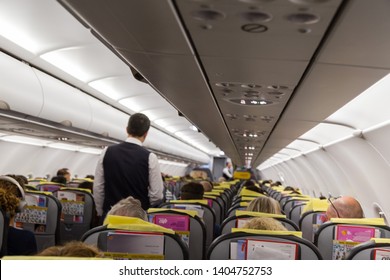 Tel Aviv, Asia / Israel - May 3, 2019:Flight attendant and passozhiri sit back in the seats of the cabin of the airline Pegasus