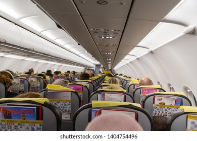 Tel Aviv, Asia / Israel - May 3, 2019: passengers sit with their backs in the seats of Pegasus aircraft