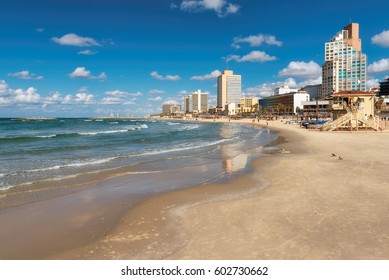 Tel Aviv beach with a view of Mediterranean sea and skyscrapers, Israel.