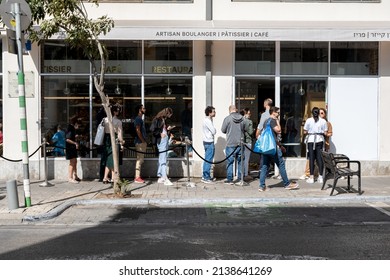 Tel Aviv, Israel - April 22, 2021: queue to the bakery on Rothschild boulevard 