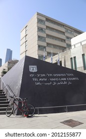 TEL AVIV, ISRAEL - APRIL 5, 2021: Tel Aviv - Yafo Law Courts. Sign of 7 branches Menorah on the black pyramid. East entrance.