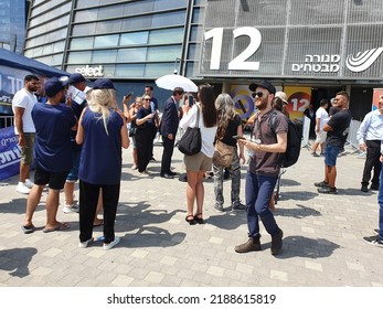 Tel Aviv, Israel - August 10, 2022: Voters Gather Around Journalist Boaz Bismuth. Likud Party Primary Election At Menora Mivtachim Arena. Entrance Gate 12.