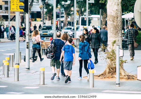 Tel Aviv\
Israel December 23, 2019 View of unidentified people walking in the\
streets of Tel Aviv in the\
afternoon