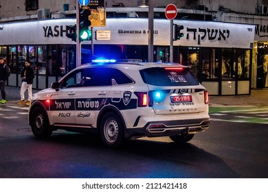 Tel Aviv, Israel - February 05, 2022 Police car rolling in the streets of Tel Aviv during the coronavirus outbreak hitting Israel