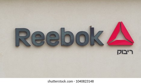 TEL AVIV, ISRAEL - FEBRUARY 08, 2018. Reebok logo at the entrance in Reebok store. Reebok is a global athletic footwear and apparel company, operating as a subsidiary of Adidas since 2005. 
