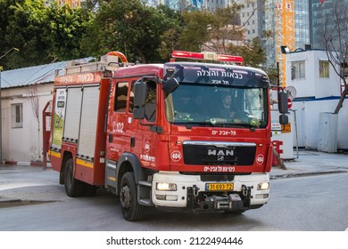 Tel Aviv, Israel - February 09, 2022 Fire engine driving through the streets of Tel Aviv during the coronavirus outbreak hitting Israel