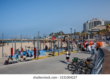 TEL AVIV, ISRAEL - FEBRUARY 25, 2022 : Group Of Young Men Doing Exercises At Outdoor Physical Fitness Area On 
 Mediterranean Seaside Of Tel Aviv.  Israel.