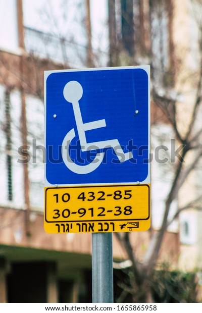 Tel Aviv Israel February 25, 2020\
View of street sign in the city of Tel Aviv in the\
evening