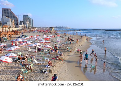 TEL AVIV, ISRAEL - JUNE 19, 2015 : Tel-Aviv beach and people enjoying the evening on the eve of the day off (Mediterranean sea. Israel)