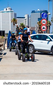 Tel Aviv, Israel - June 27, 2021: Group Of People On Segway Tours Are A Great Experience For Everyone, In Every Season. Even When The Weather Is Very Hot. Maybe Learning To Ride A Segway