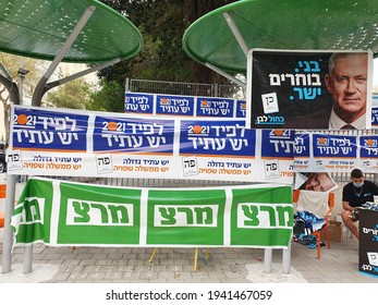 TEL AVIV, ISRAEL - MARCH 23, 2021: Election day. Posters and banners of different parties hanging outside Arazim elementary school entrance. 
