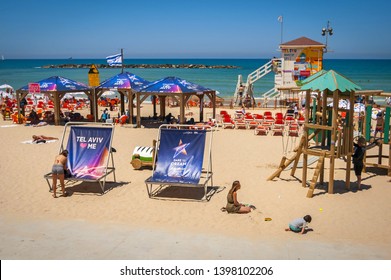 TEL AVIV, ISRAEL. May 11, 2019. Tel Aviv seaside promenade and beach prior to the Eurovision song contest 2019. Huge beach chairs with the Eurovision logo, summer time, tourists.