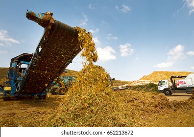 Tel Aviv, Israel, May 20 2012: Special Equipment Machine With Crane Granulate Crush Tree Branches Wood. Natural Bio Fuel Biomass Production 