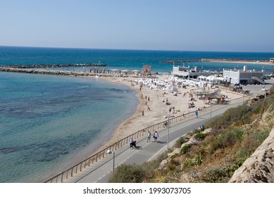 TEL AVIV, ISRAEL - May 24, 2021: People enjoying the summer on beach in Tel Aviv, Israel