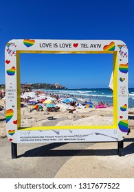 Tel Aviv, Israel NOVEMBER 19, 2018: Frame Of Love Overlooking The Beach Of Tel Aviv With The Image Of Hearts In The Colors Of The Rainbow As A Symbol Of Natural Love. Photoframe On The Beach Romance