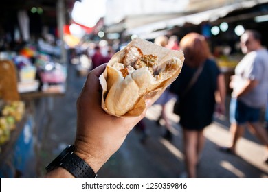 Tel Aviv/Israel November 7, 2018 Falafel And Fresh Vegetables In Pita Bread On Wooden Table