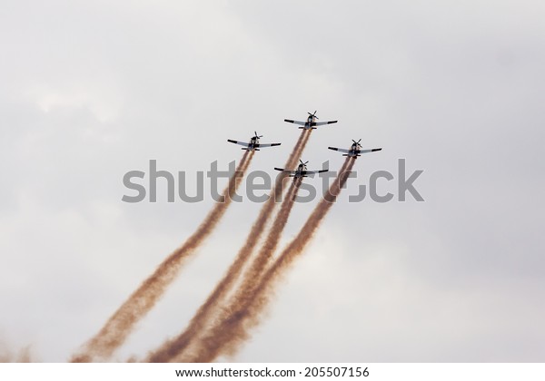 TEL NOF, ISRAEL -APRIL\
16: Four army training airplanes performing an exhibition exercise\
during the Israeli Independence day show on April 16, 2013 in Tel\
Nof, Israel.