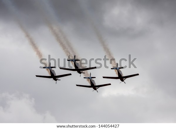 TEL NOF, ISRAEL -APRIL\
17: Four army training airplanes performing an exhibition exercise\
during the Israeli Independence day show on April 17, 2013 in Tel\
Nof, Israel.