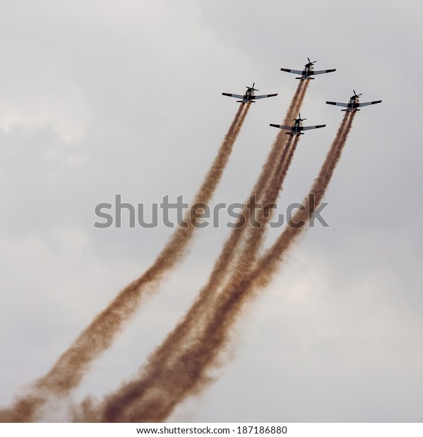 TEL NOF, ISRAEL -APRIL
17: Four army training airplanes performing an exhibition exercise
during the Israeli Independence day show on April 17, 2013 in Tel
Nof, Israel.